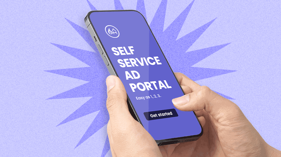 An imagine of a hand holding a phone that says "self service ad portal"