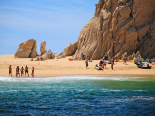Tourists on Lover's Beach in Cabo San Lucas, Mexico