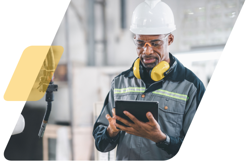 image of a person in a hardhat in a warehouse masked by a parallelogram