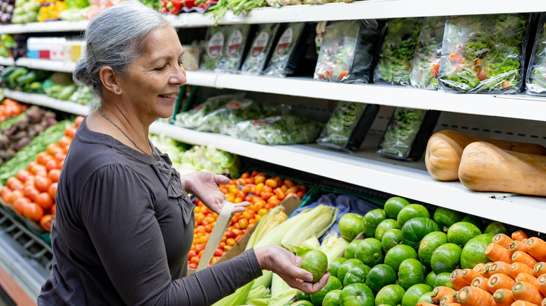 Older woman shopping for vegetables