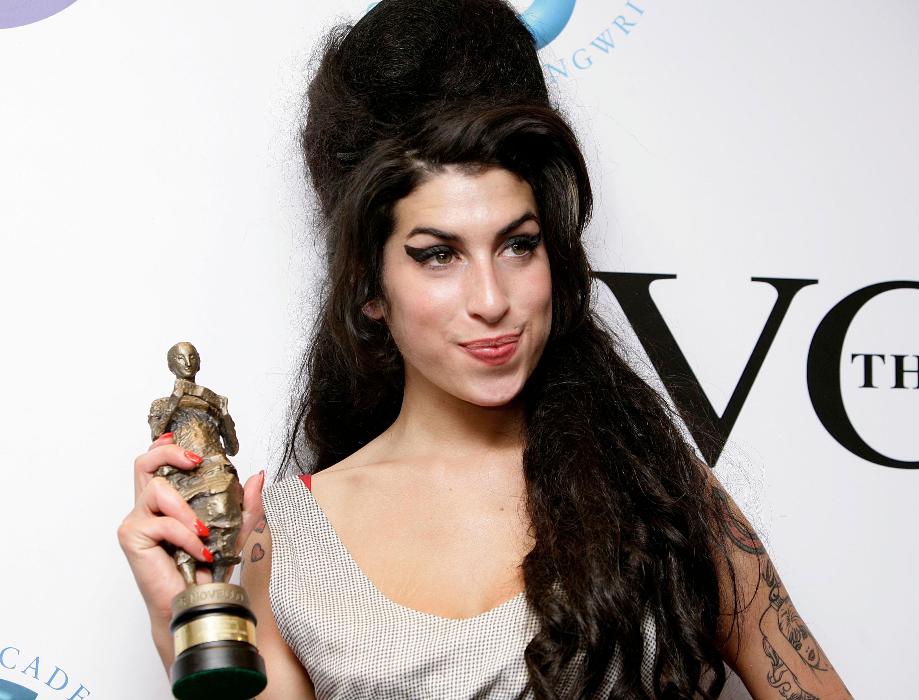Amy Winehouse death. RETRANSMISSION: Amends years since her death to 10 in caption. File photo dated 24/05/07 of Amy Winehouse after winning the Best Contemporary song award for her song 'Rehab' at the Ivor Novello Awards, at the Grosvenor House Hotel in cental London. Fans will mark 10 years since her death on Friday. Issue date: Friday July 23, 2021. The singer, best known for songs including Back To Black and Rehab, died of alcohol poisoning at the age of 27 at her home in Camden, north London, on July 23 2011. See PA story ANNIVERSARY Winehouse. Photo credit should read: Yui Mok/PA Wire URN:61094940 (Press Association via AP Images)