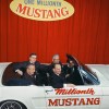 Airline Captain Stanley Tucker with Lee Iacocca and Ford executives in the one-millionth Ford Mustang