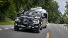 The 2024 Ford F-150 Hybrid towing an RV