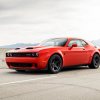 A red 2020 Dodge Challenger Super Stock parked on the highway left front angle view