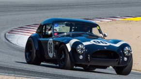 Jim Farley's Shelby Cobra racing around a track
