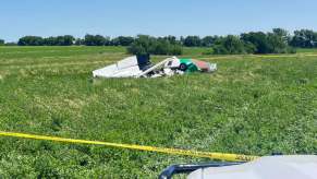 The metal crash debris of a Cessna airplane in a field
