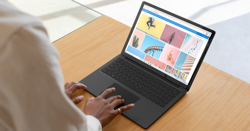 An image of woman browsing in Edge on Black Surface Laptop 3.