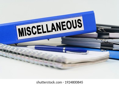 Business and finance concept. On the table are a notebook, a pen, documents and a folder with the inscription - MISCELLANEOUS Stock Photo