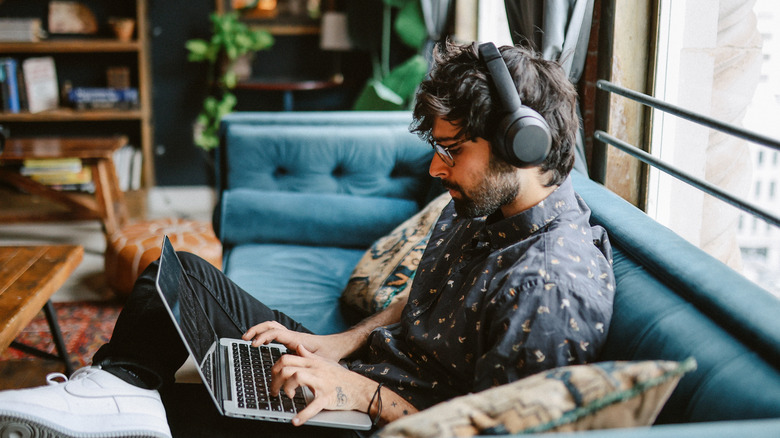 man working from living room