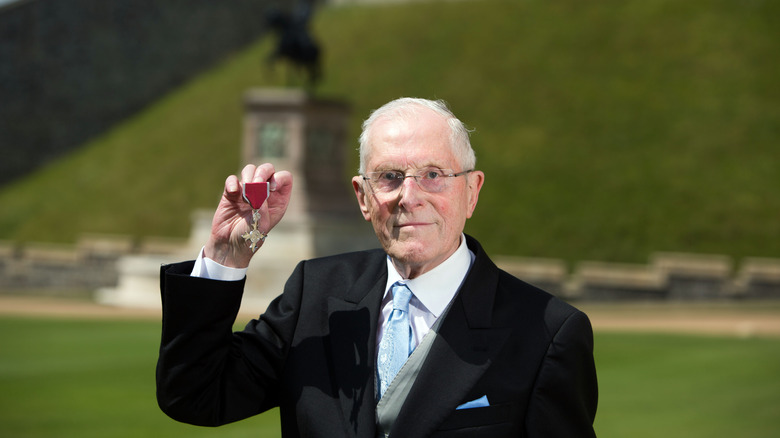 Ron Ayers holding medal