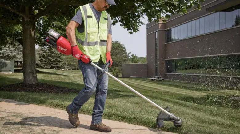 Man using a weed eater 