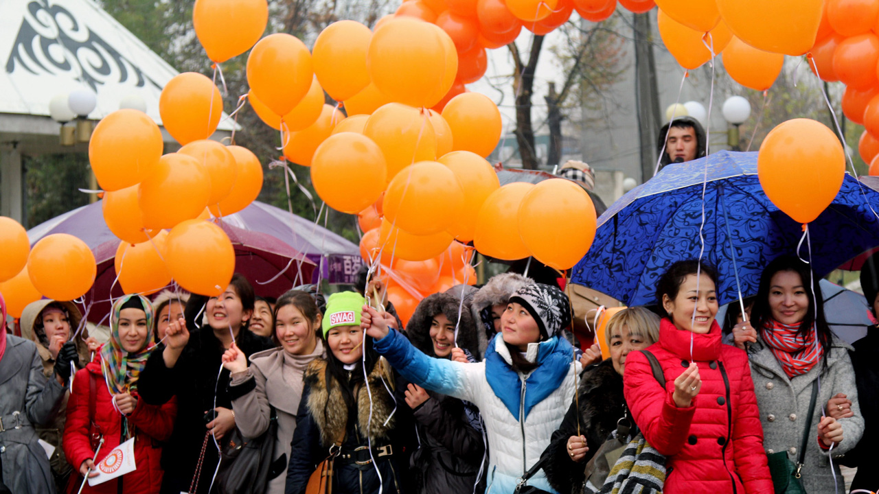 Young women holding bunch of orange balloons campaign for the 16 Days of Activism against Gender-based Violence, Kyrgyzstan