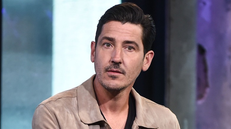 Jonathan Knight with a neutral expression