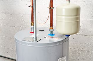 Water heater with expansion tank and pipes on top