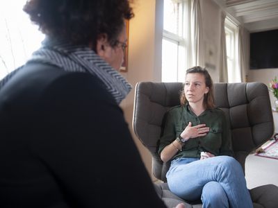 young woman talking to a counselor