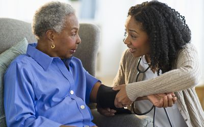Older person has blood pressure taken