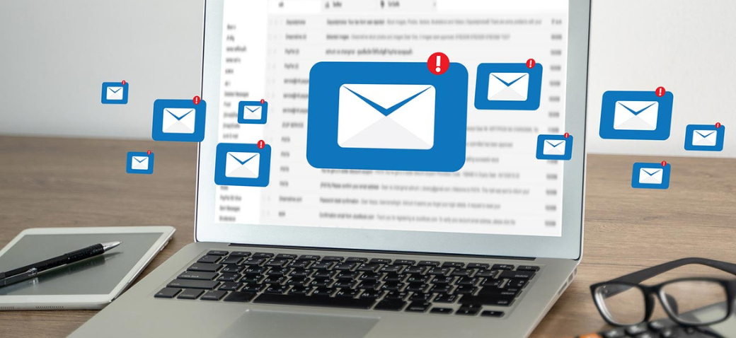 Email apps floating in front of a laptop