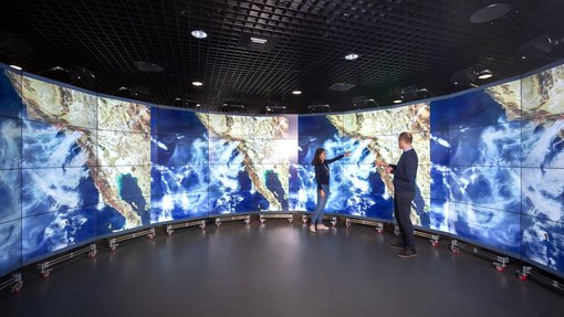 looking at climate data in exhibition space