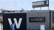 A man walks past the Woolworths truck entrance in Cape Town, South Africa, 26 February 2024. Source: REUTERS/Esa Alexander/file photo.
