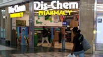 A person walks past a Dis-Chem Pharmacy outlet in Cape Town, South Africa 22 February 2024. Source; REUTERS/Esa Alexander/file photo.