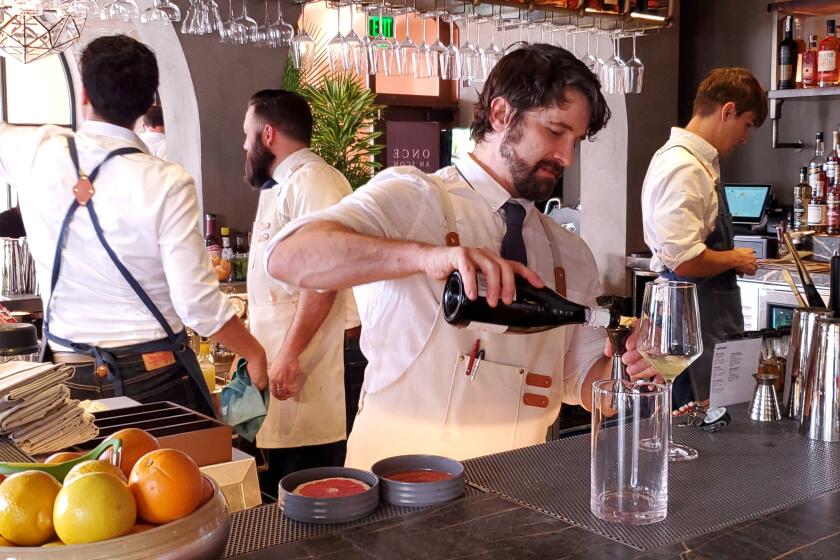 Bartenders work to create The Whaling Bar's signature cocktails.