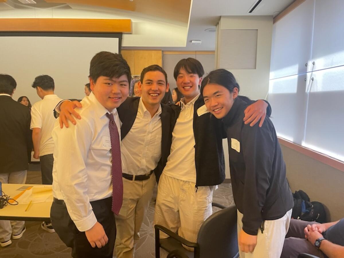 Jeremy Feng, Charlie Ahn, Ryan Qin and Jack Jin celebrate their win at the state level of the National Economics Challenge.