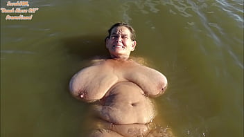 beach rinse off, side ponytail, huge saggy granny tits, calm sea