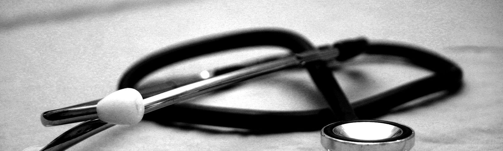 picture of a stethoscope laying on a table.