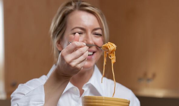 Woman eating spaghetti