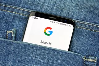 Google search on a smartphone poking out of a pocket