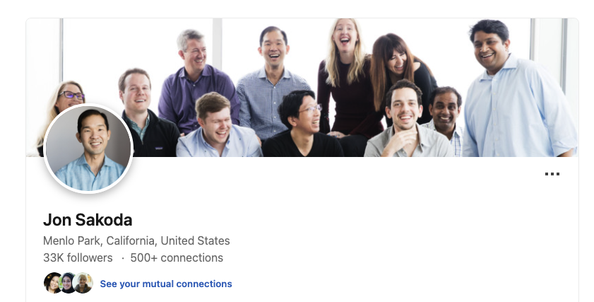 Jon Sakoda’s Linkedin profile showing a photo with staff.