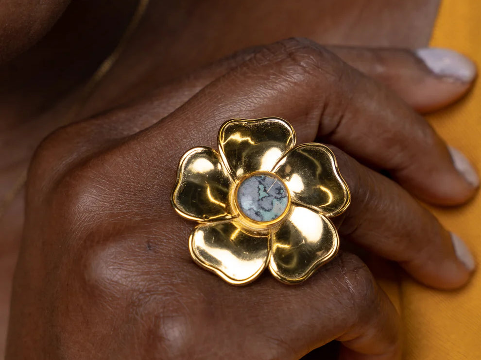 Close shot of a woman's hand wearing a flower ring
