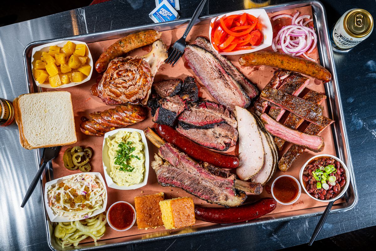 A platter of meats and Salvadoran-influenced sides from 2Fifty Texas BBQ.