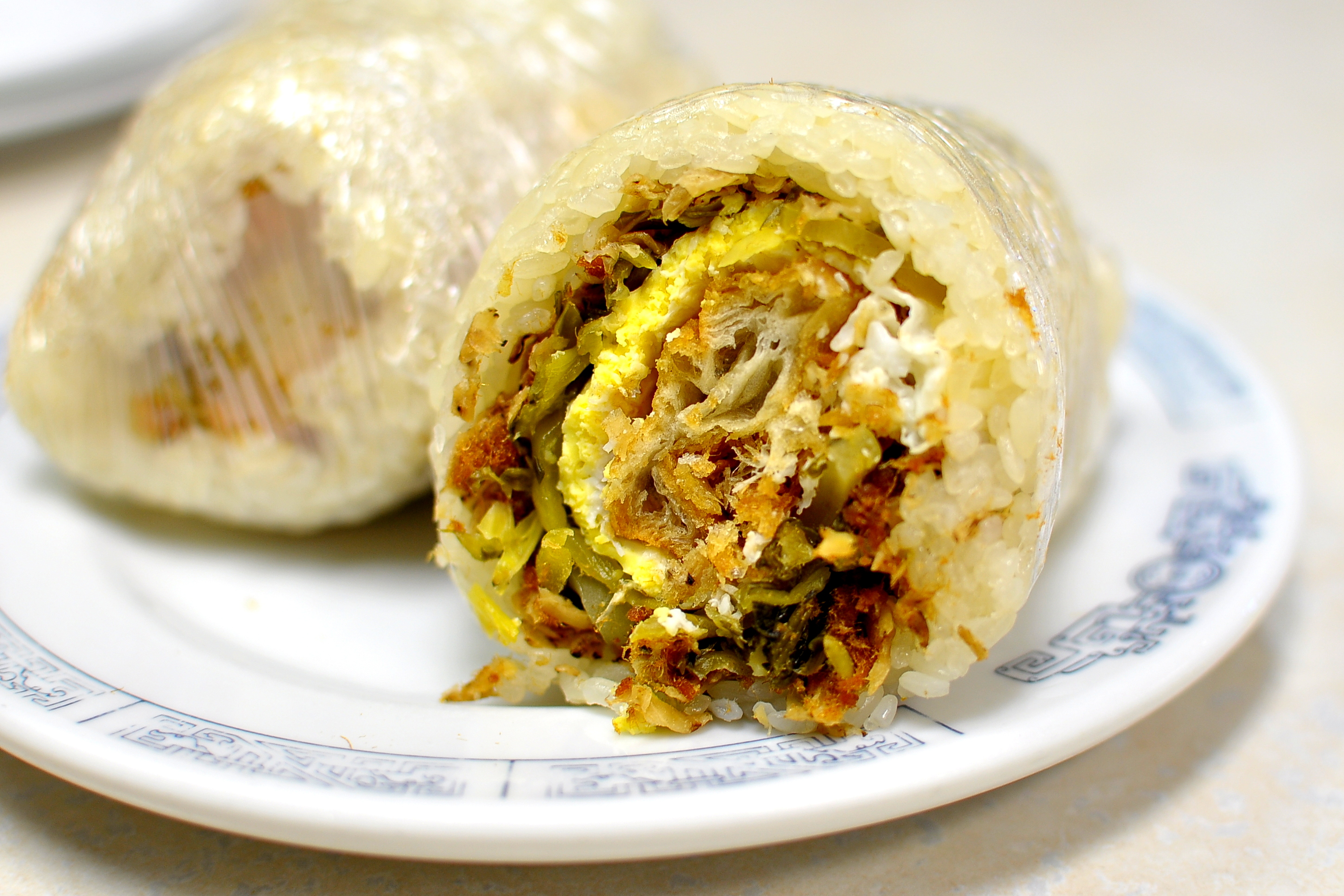 A plate containing fun tuan — a rice roll filled with meat, pickles, and eggs — at Huge Tree Pastry in Monterey Park.