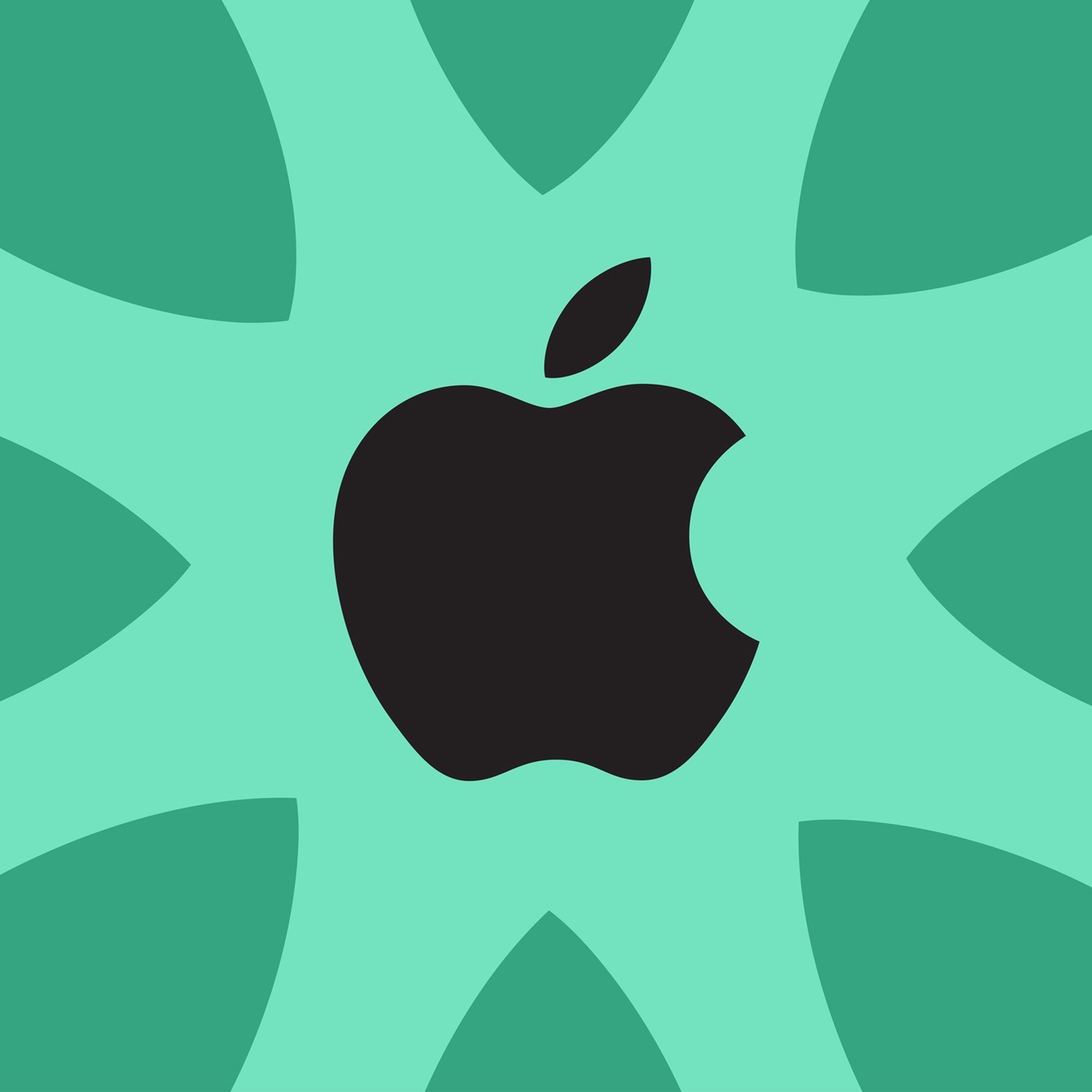 Green backdrop, black apple logo, apple leaves surrounding
