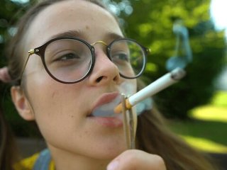 nerdy girl glasses, solo female, smoking fetish, outside
