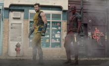 Deadpool and Wolverine walking through mist.