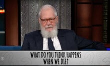 A man sits in a talk show chair. The question at the bottom of the screen reads "What do you think happens when we die?"