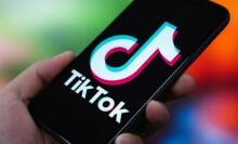 In this photo illustration, the TikTok logo is displayed on the screen of a smartphone.