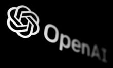 OpenAI logo displayed on a phone screen in this illustration