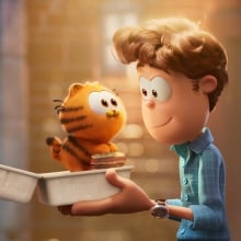 Garfield as a kitten and Jon from "The Garfield Movie."