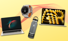 Samsung Galaxy Book, Hydro Flask bottle, Garmin watch, and MacBook Air with yellow and red background