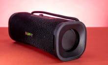 black rectangular sony speaker on red background