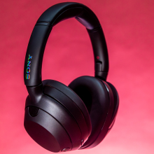 sony over-ear headphones against a pink background
