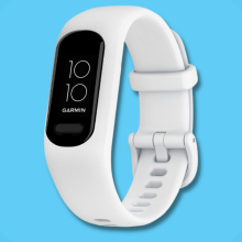 white fitness tracker against blue background