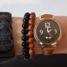 Garmin Lily 2 watch on wrist with bracelets