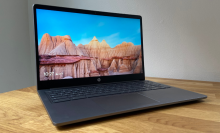 a side angled view of the hp chromebook plus 15.6-inch on a wooden table