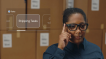 A woman reviews shipping tasks using Google Glass.
