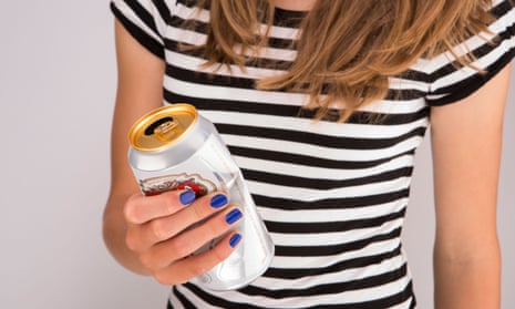 Young woman holding beer can