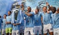 Kyle Walker of Manchester City lifts the Premier League trophy after winning this season’s title.